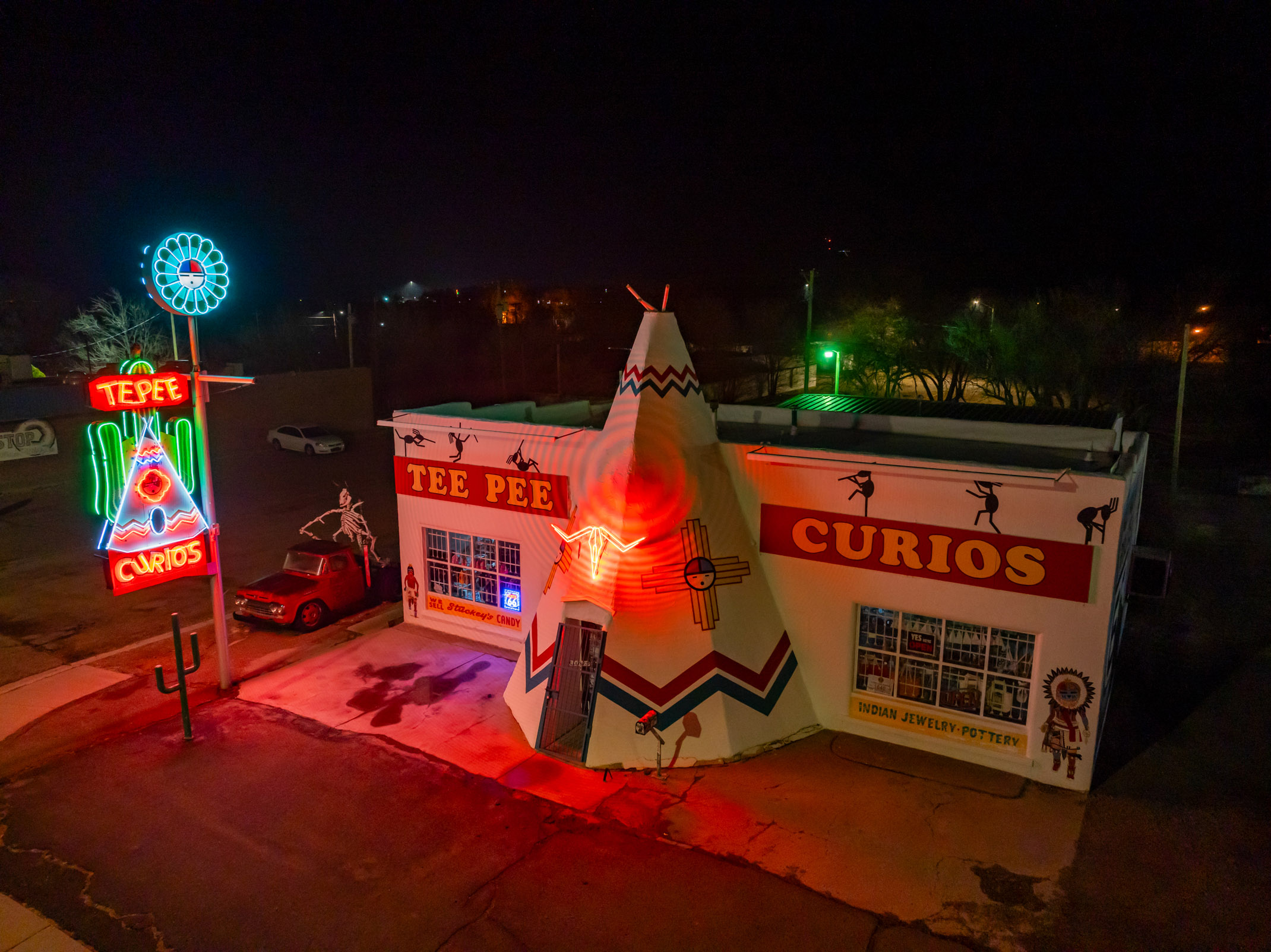 Neon signs illuminate the exterior of Tee Pee Curios in Tucumcari