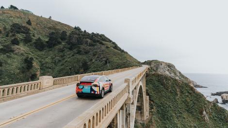 Car driving on Bixby Bridge in Big Sur, California