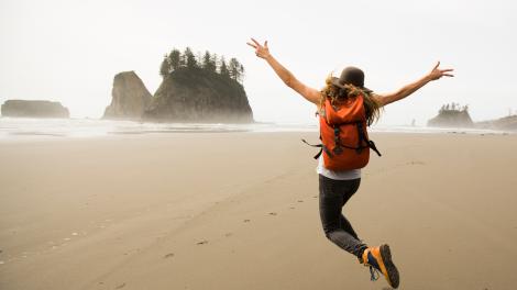 Girl jumping on the beach.