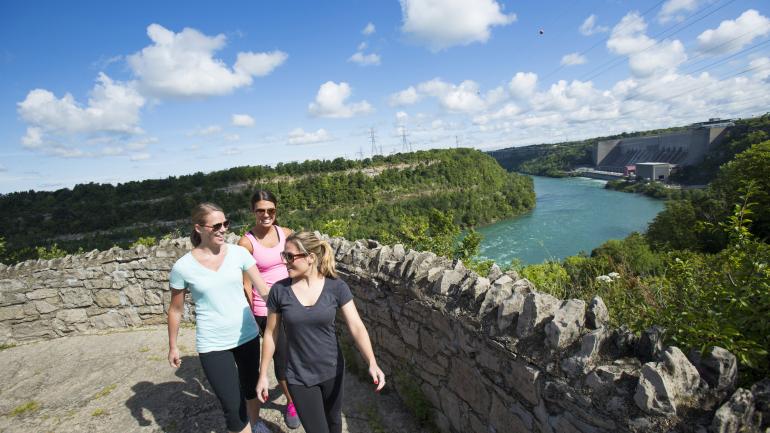 Friends hiking one of several trails surrounding the falls 