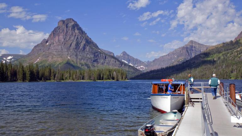 Historic wooden boat tour on Two Medicine Lake at Glacier National Park