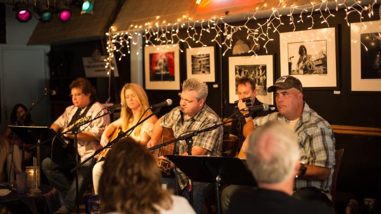Listening to music in the popular Bluebird Cafe in Nashville