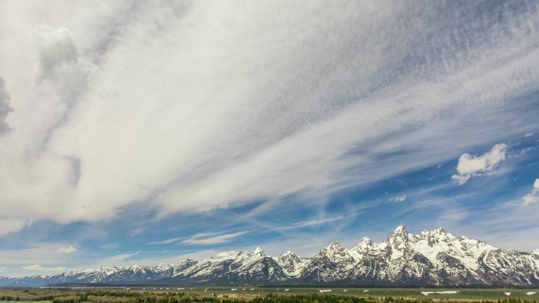 Vast open spaces and majestic mountains dot Wyoming's rugged landscape.