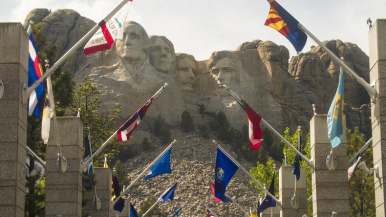 The Avenue of Flags leading up to the base of Mount Rushmore