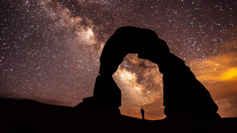 Marveling at the star-filled sky from Delicate Arch in Arches National Park