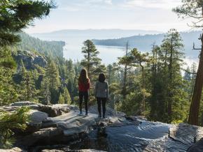 Women overlooking Lake Tahoe from Emerald Bay State Park in California Women overlooking Lake Tahoe from Emerald Bay State Park in California
