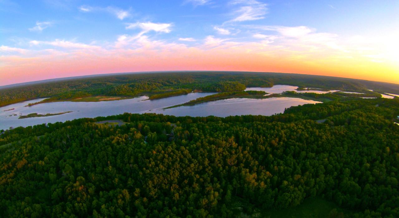 Lake Superior waterways and surrounding forest at sunset