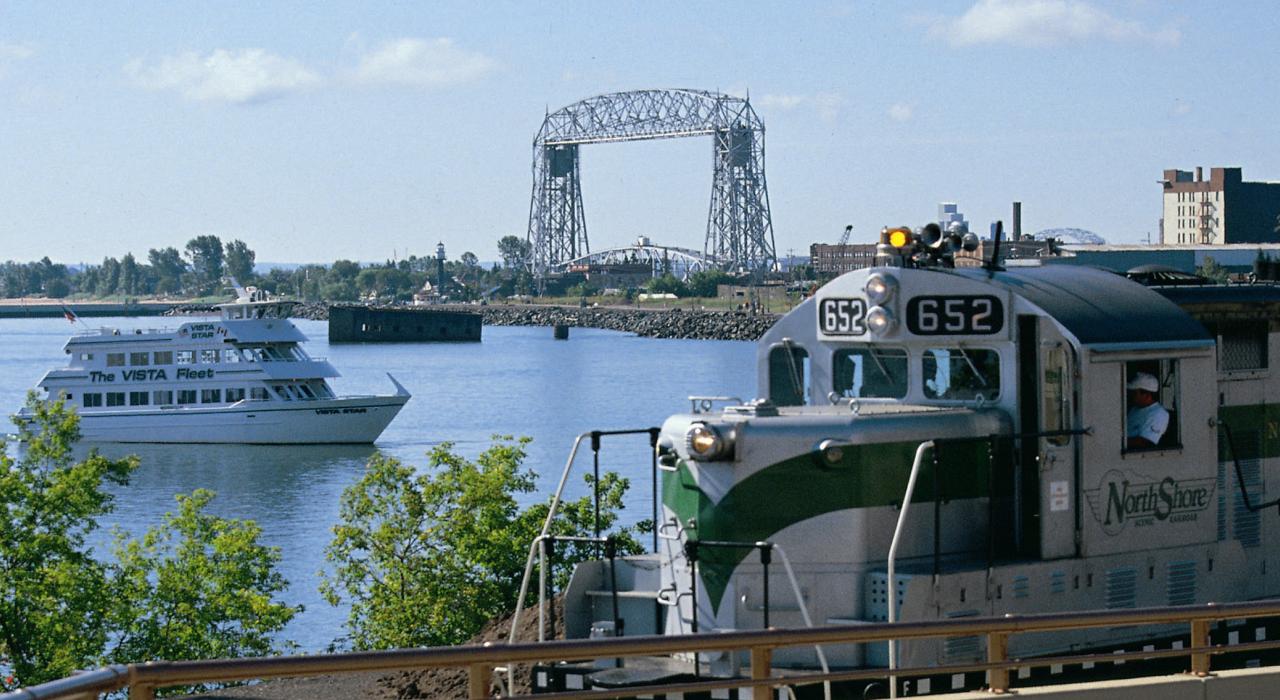 A North Shore train slips by the Vista Star craft