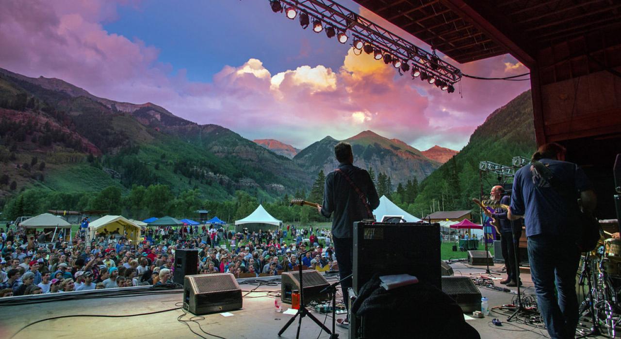Hundreds of people enjoying live music at a festival