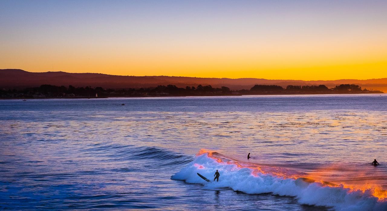 Surfing off the coast of Santa Cruz County in California